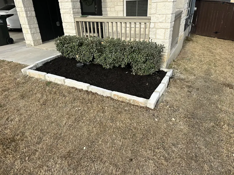 Front yard mulch bed and shrub landscaping at a home in Cibolo, TX
